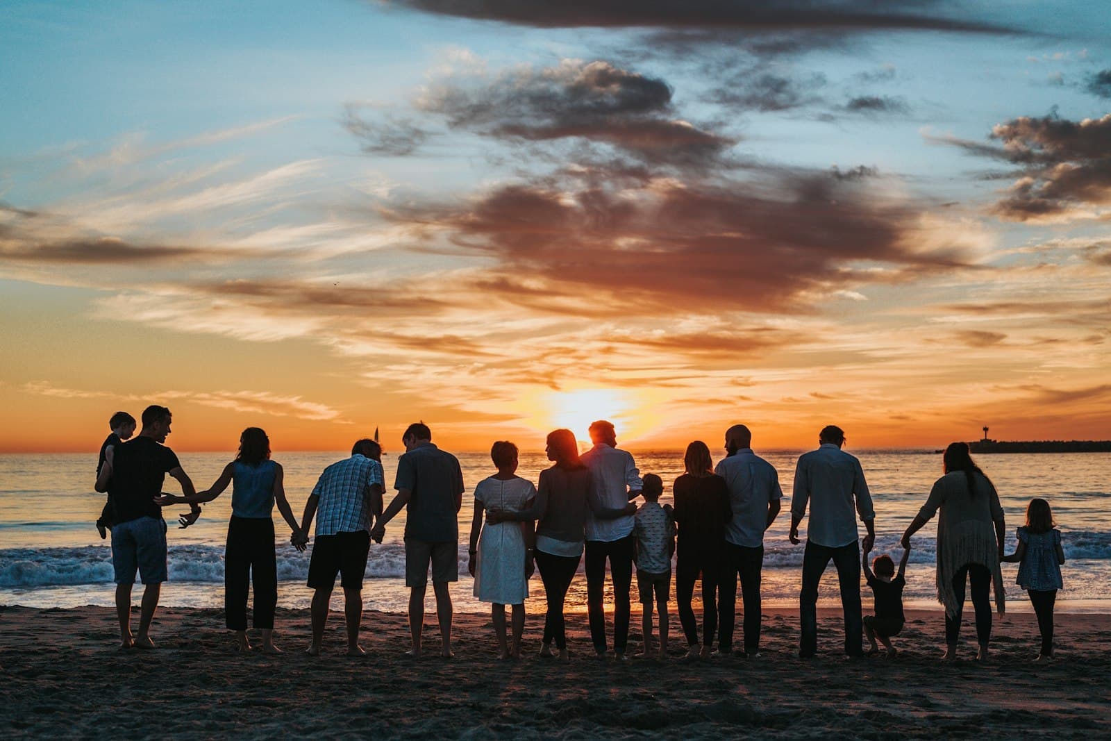 Family watching a sunset on the beach