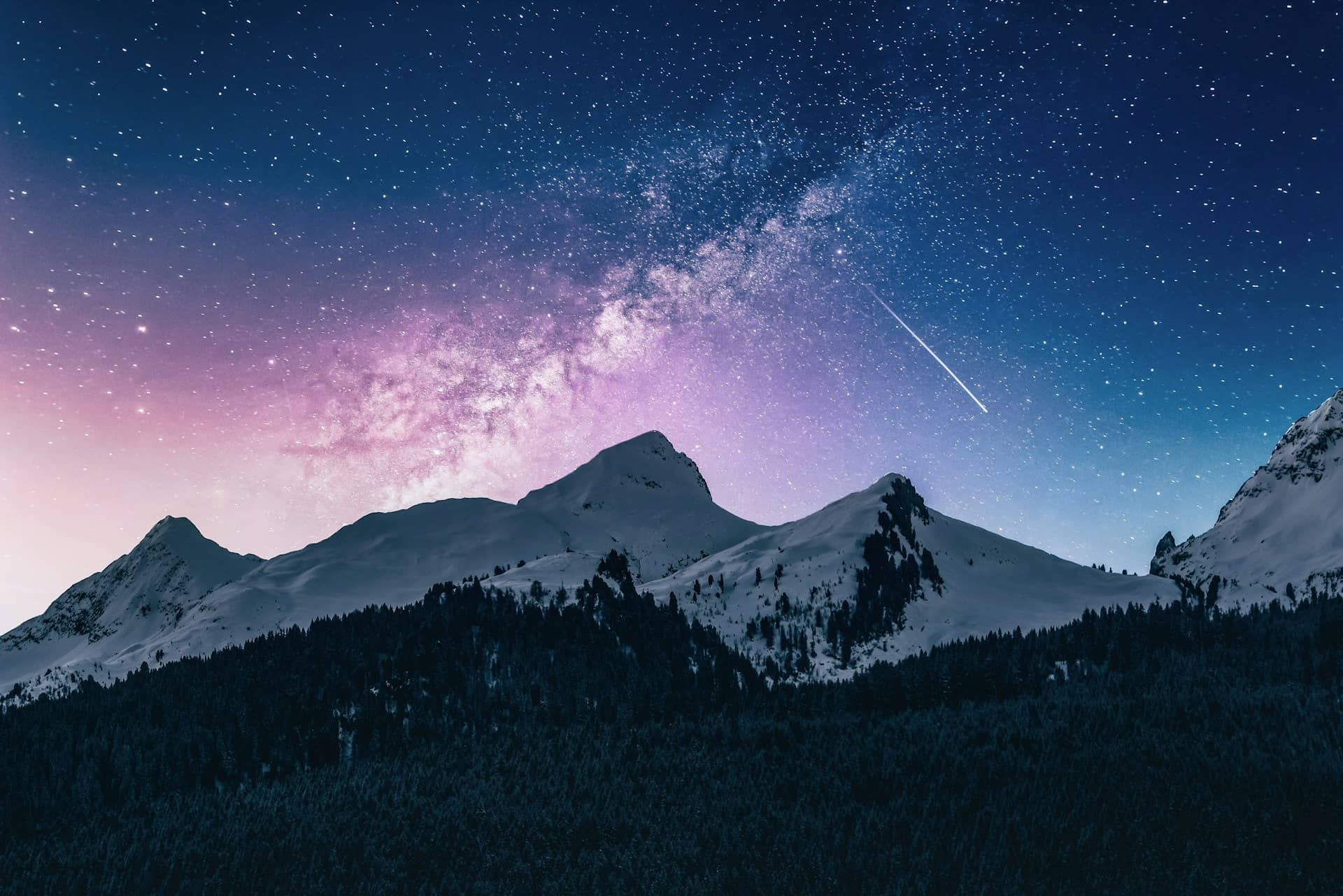Panoramic mountain vista with rolling peaks under a clear sky